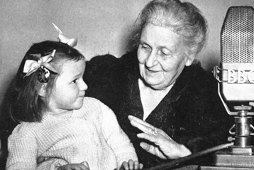 Maria Montessori engaging with a young girl during a BBC radio broadcast.